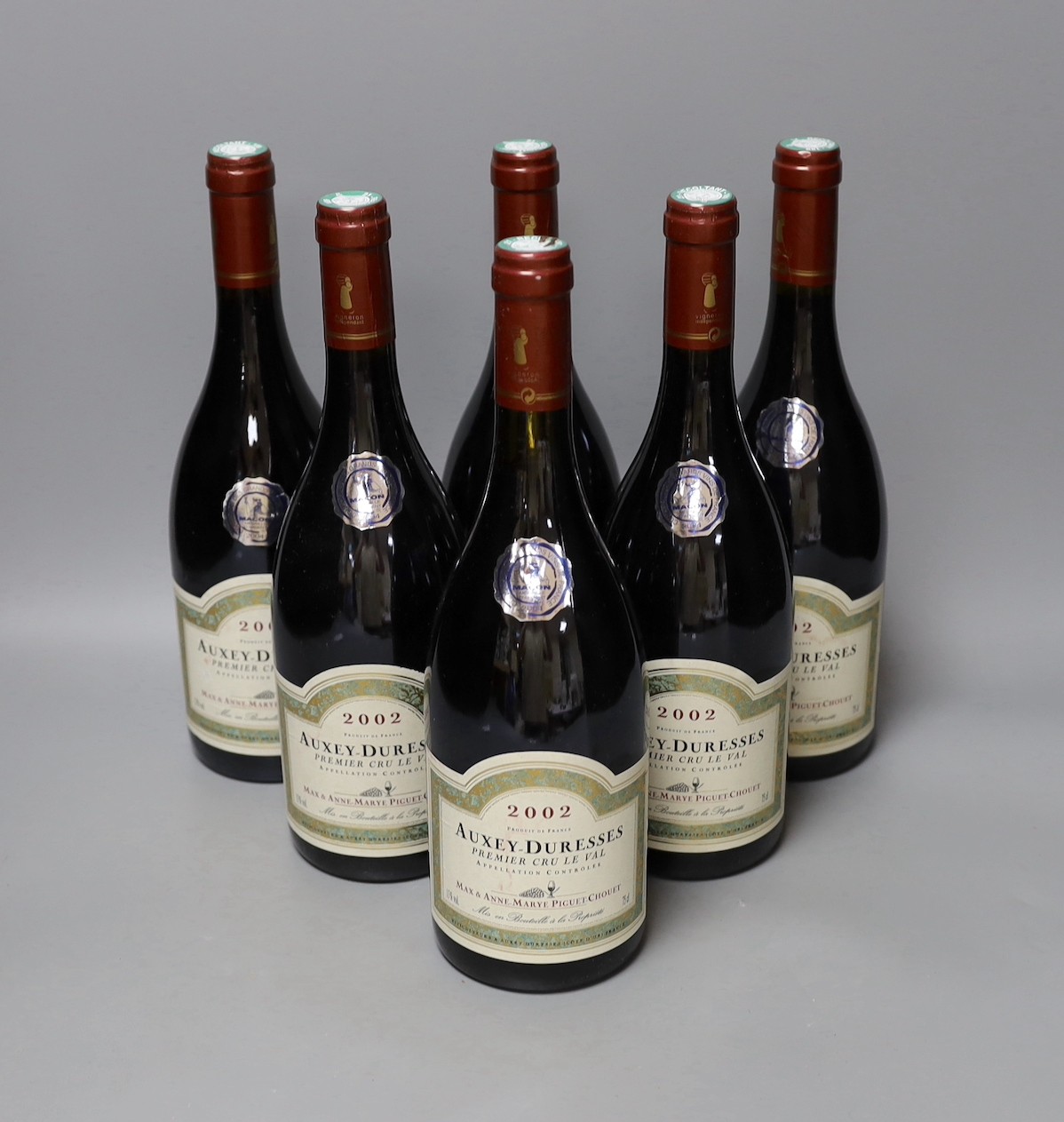 Six bottles of Auxey-Duresses Premier Cru, 2002.